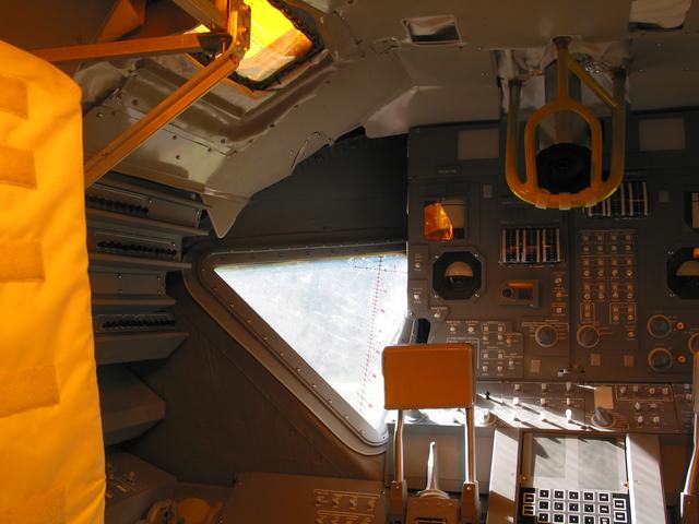 LEM, 2003-2007, 13'X11'X14', aluminum, steel, epoxy, wood, rubber, money
Interior view looking forward, CDR (Commander) Station