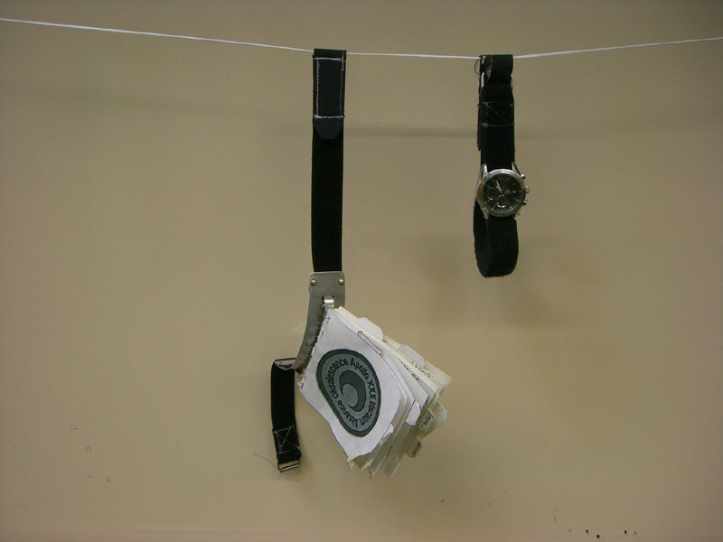 Conrad Carpenter's Cuff Checklist and Omega Speedmaster Professional Chronometer on display at his Memorial Service.