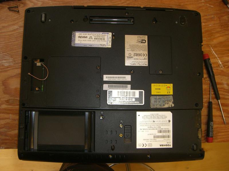 REPAIR OF PORTABLE MISSION CONTROL MAIN COMPUTER

After opening the case and removing several components, the power supply board was separated from the system board. 

(procedure continued...)