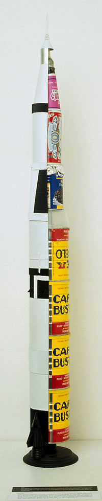 Saturn V Rocket, 2000, displaying various kinds of fuel necessary for artistic endeavor. Work now missing.
